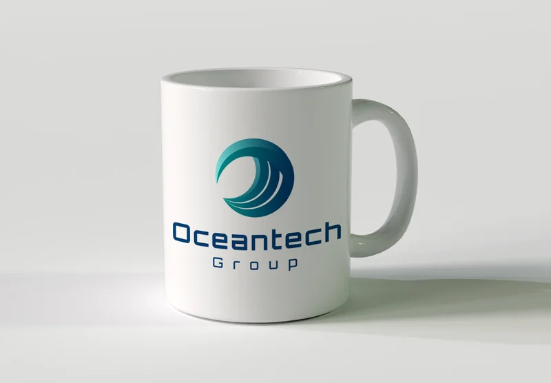 White mug with the Oceantech Group logo