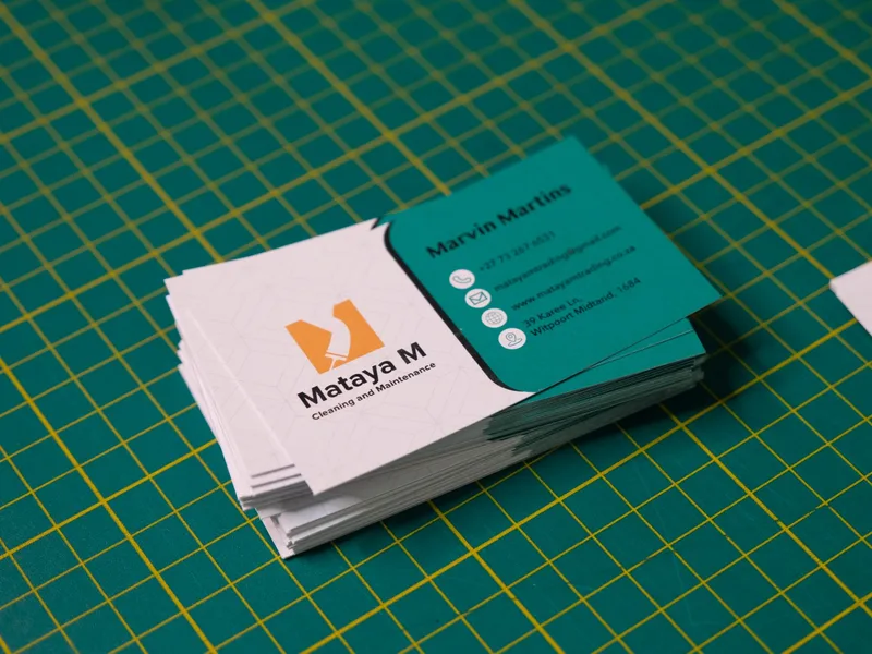 Stack of printed Mataya M Cleaning and Maintenance business cards